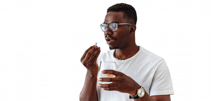 Black man taking a blue pill