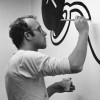 Haring painting a mural at the Stedelijk Museum in Amsterdam, Netherlands, 1986