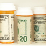 pill bottles with money as labels cost of healthcare