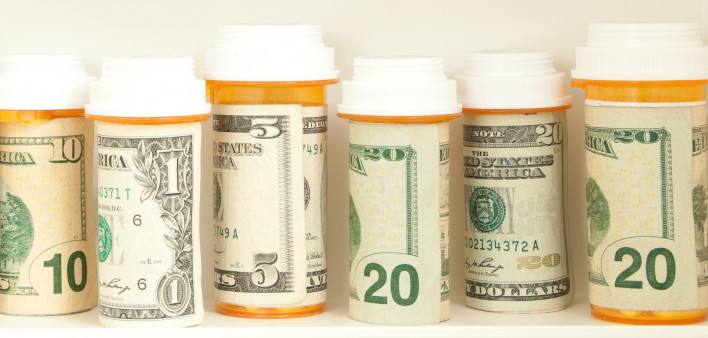 pill bottles with money as labels cost of healthcare