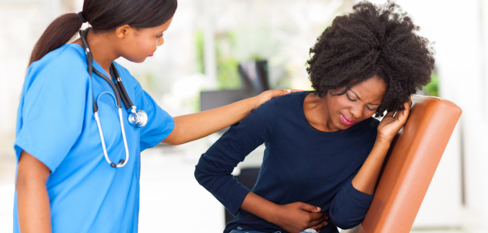 woman girl stomach cramps with nurse