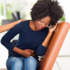 woman girl stomach cramps with nurse