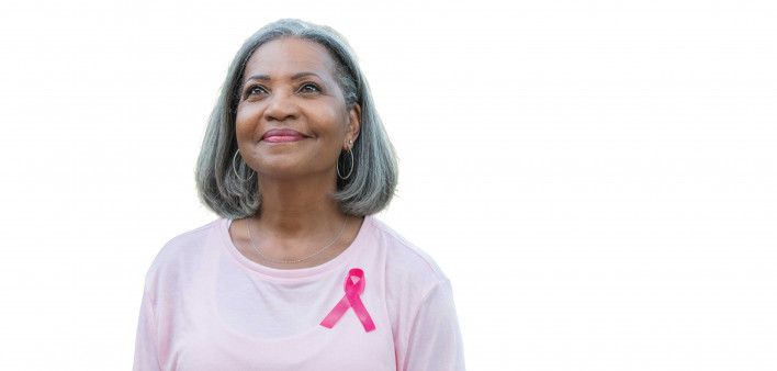 Beautiful senior woman smiles while walking for breast cancer awareness