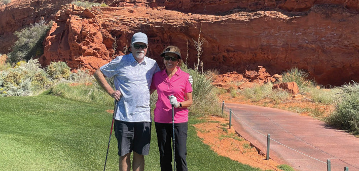 Terry Evans  and his wife play golf in Utah.