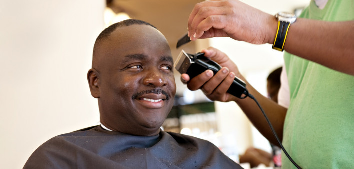 African American Barber Shop Smile man getting hair cut
