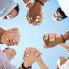 group of people holding hand to form a circle support