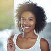Woman holding toothbrush