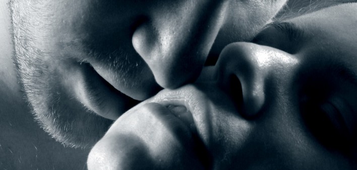 a man and woman about to kiss