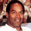 O.J. Simpson watches a football game, Thanksgiving 1990, with U.S. troops serving in Operation Desert Shield