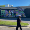 OIDP’s LT. Erica Bussey Jones and CAPT John Oguntomilade at a mural commemorating Black Wall Street in Tulsa, Oklahoma