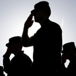 Soldiers Salute the Flag at Sunset