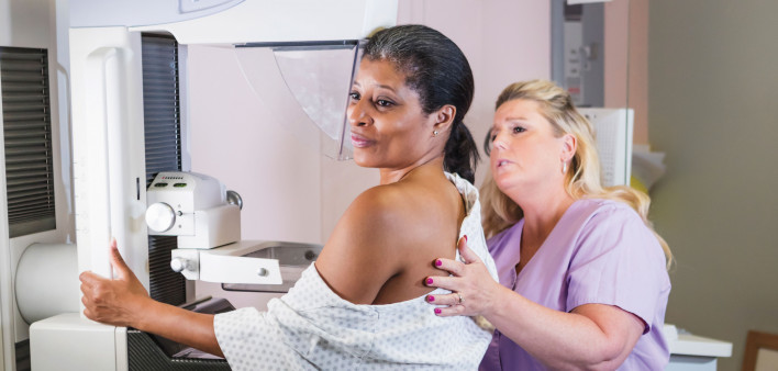 african american woman getting a mammogram