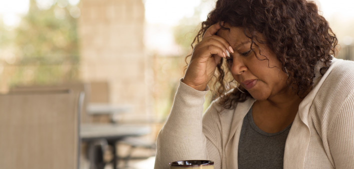 African American middle age woman looking sad.