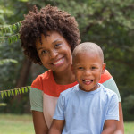 African American mother holding her son