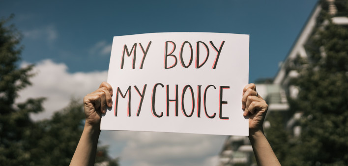 Woman holding a sign My Body, My Choice