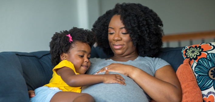 pregnant mother and young girl