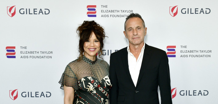 Actress Rosie Perez and Arthur Fogel, who leads the global touring division of Live Nation Entertainment, at the Elizabeth Taylor AIDS Foundation New York Dinner on May 8, 2024