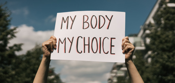 Woman holding a sign My Body, My Choice