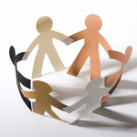 paper cut out dolls joined hands in a circle