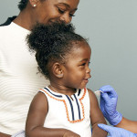 little girl and mother vaccine