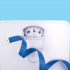 scale and blue tape measure weight