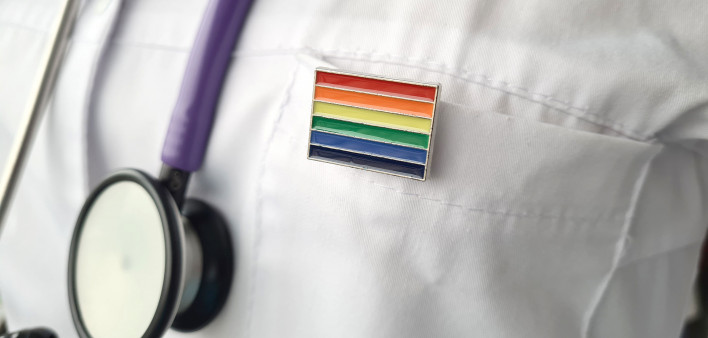 Woman doctor with lgbt flag on the pocket