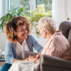 caregiver and elderly woman patient, nurse