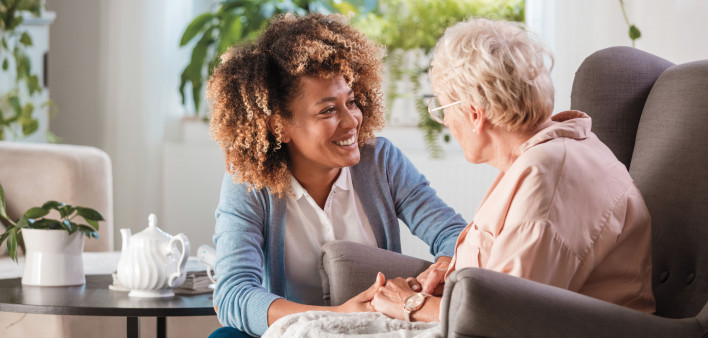 caregiver and elderly woman patient, nurse