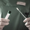 Nurse holds a swab for the coronavirus / covid19 tes