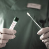 Nurse holds a swab for the coronavirus / covid19 tes