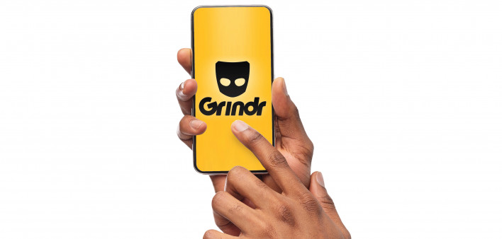 hands holding iphone smart phone touching screen