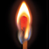 lit match on a black background