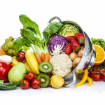 Healthy fresh fruits and vegetables in a colander