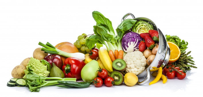 Healthy fresh fruits and vegetables in a colander