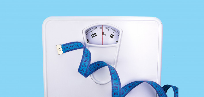 scale and blue tape measure weight