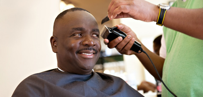 African American Barber Shop Smile man getting hair cut