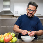 A healthy Latino man living with HIV in the kitchen