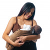 woman nursing her baby holding baby