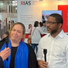 From left: HIV.gov director Miguel Gomez talks with Janet Butler-McPhee of the HIV Legal Network, Robert Suttle of the Elizabeth Taylor AIDS Foundation and Francisco Ruiz of the White House Office of National AIDS.