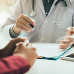 Doctor talking to the patient about menopause and treatment in future.
