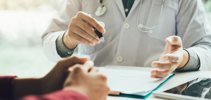 Doctor talking to the patient about menopause and treatment in future.