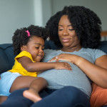 pregnant mother and young girl