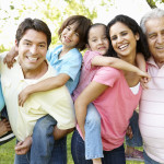 A multi-generational latin family having fun outdoors