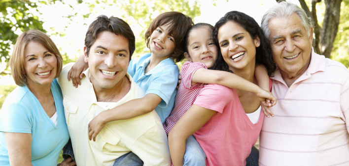 A multi-generational latin family having fun outdoors