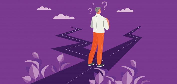 Businessman with two roads. Man evaluates both options.