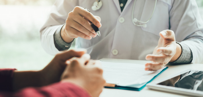 Doctor talking to the patient about menopause and treatment in future.