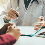 Doctor talking to the patient about menopause and treatment in future.