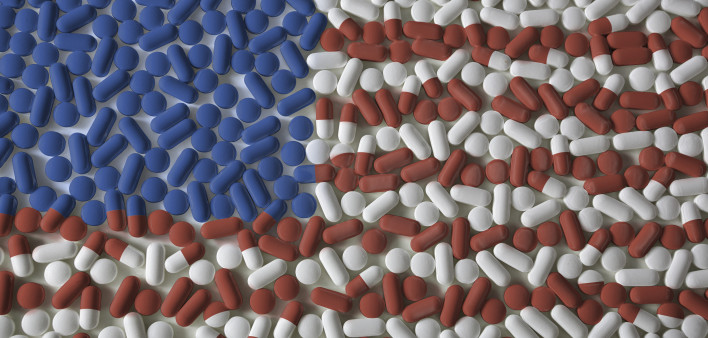Medicated United States. An American flag made from red, white, and blue pills. US Healthcare reform background concept.