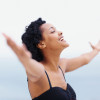 woman happy arms spread in joy