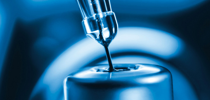 vaccine needle going into syringe